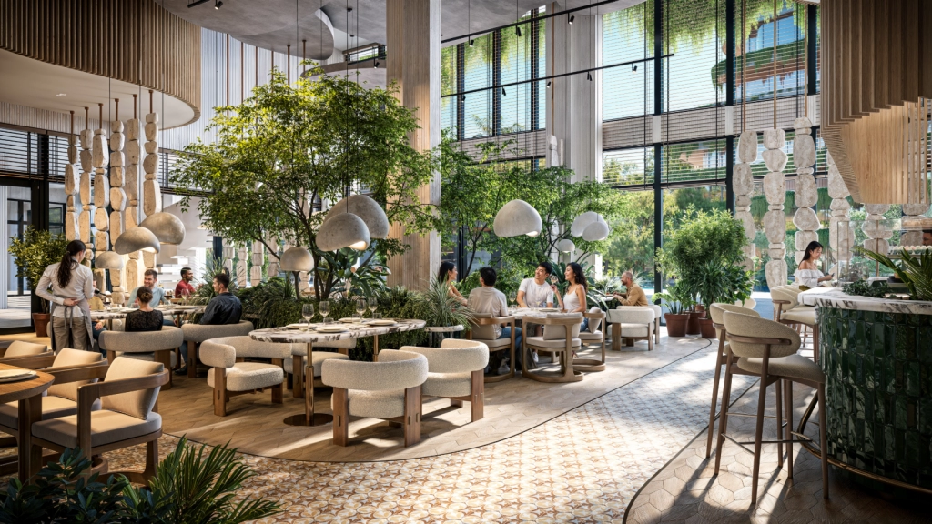 Upscale condo common area with greenery, lounge seating, and natural lighting in Thailand