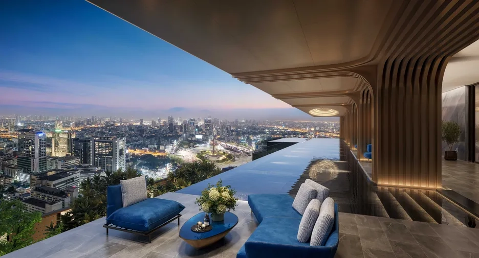 Luxury Bangkok condo with an infinity pool and panoramic city skyline views at dusk, showcasing premium real estate amenities.