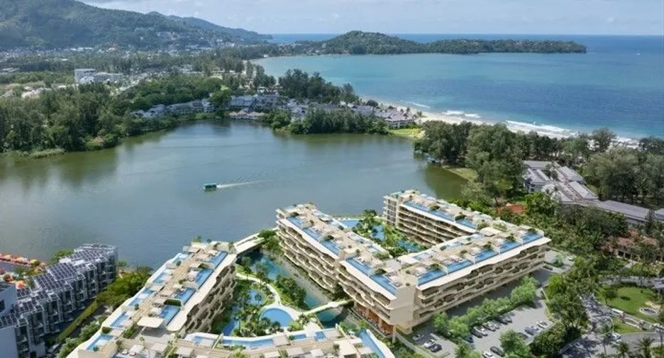 Aerial view of a luxury lakeside resort property, ideal for real property investment and building wealth through real estate.