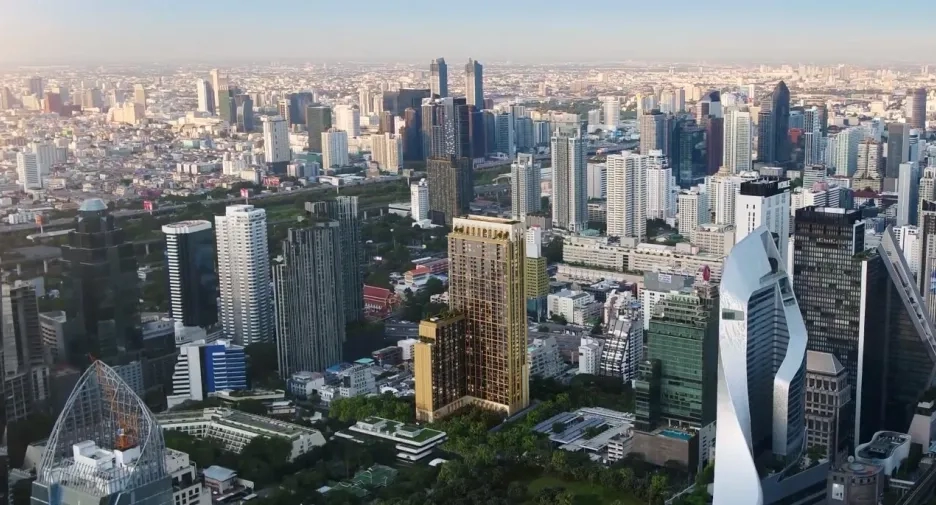 Aerial view of Bangkok's skyline with a focus on prime real estate investment properties.
