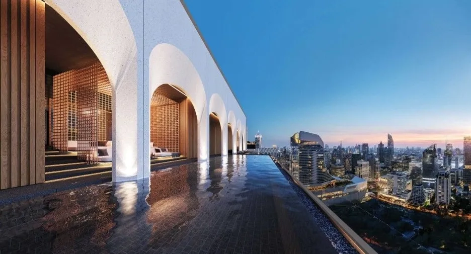 Rooftop pool with stunning city view, showcasing luxury real property investment opportunities.