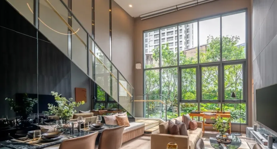 Stylish duplex living area in a BKK house at Whizdom Craftz Samyan with high ceilings and city views.
