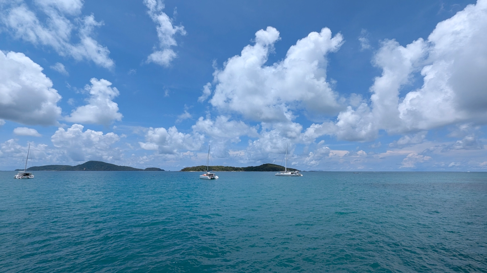 Scenic view of Rawai beach front with yachts, Phuket, near property development