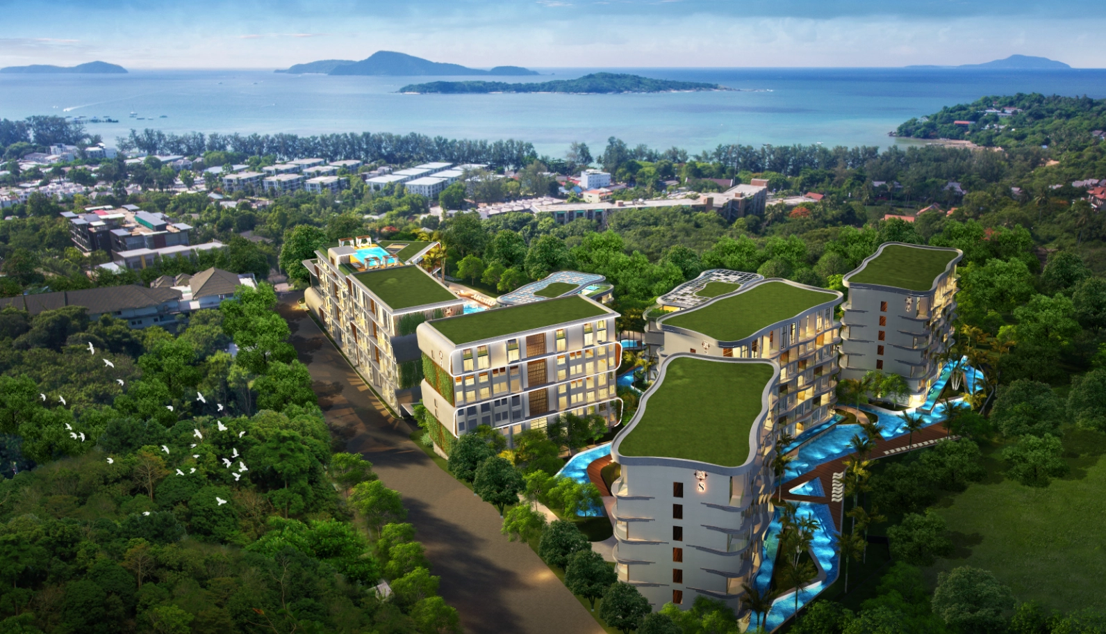 Aerial view of a modern condominium project in Rawai, Phuket, showcasing new infrastructure development and prime properties to invest in Southeast Asia.