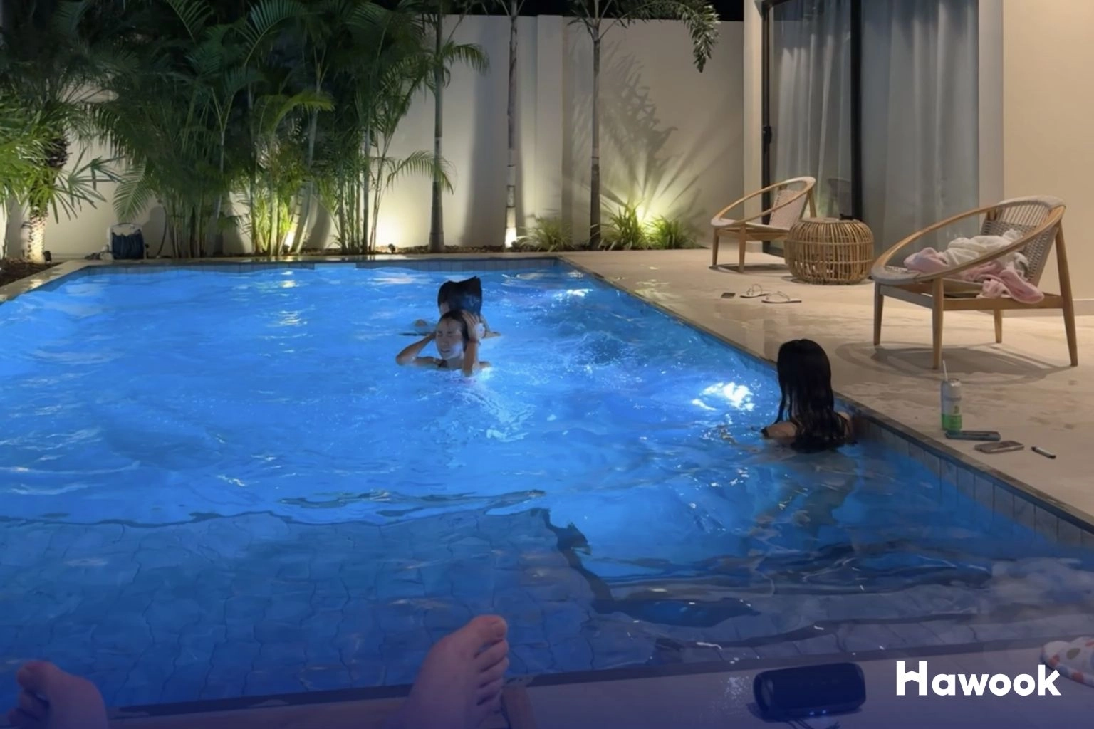 Vacationers enjoying a private pool villa managed by Blink n Sun, an example of short-term rental management in Phuket.