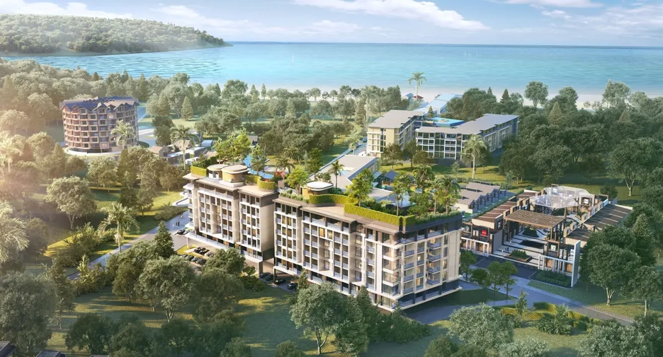 💬 News & Trends | Who’s Really Buying Property in Thailand? Foreign Buyer Data 2025 Aerial view of luxury Phuket condo development near the beach popular among foreign buyers investing in Thailand.