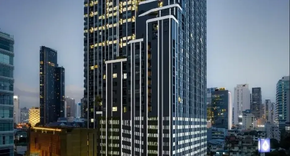 Modern high-rise condominium in the Bangkok skyline representing Thailand Property Investment opportunities.