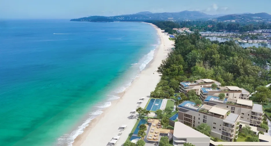 Aerial view of beachfront leasehold condominiums in Phuket, Thailand, showcasing tropical coastline and luxury real estate.