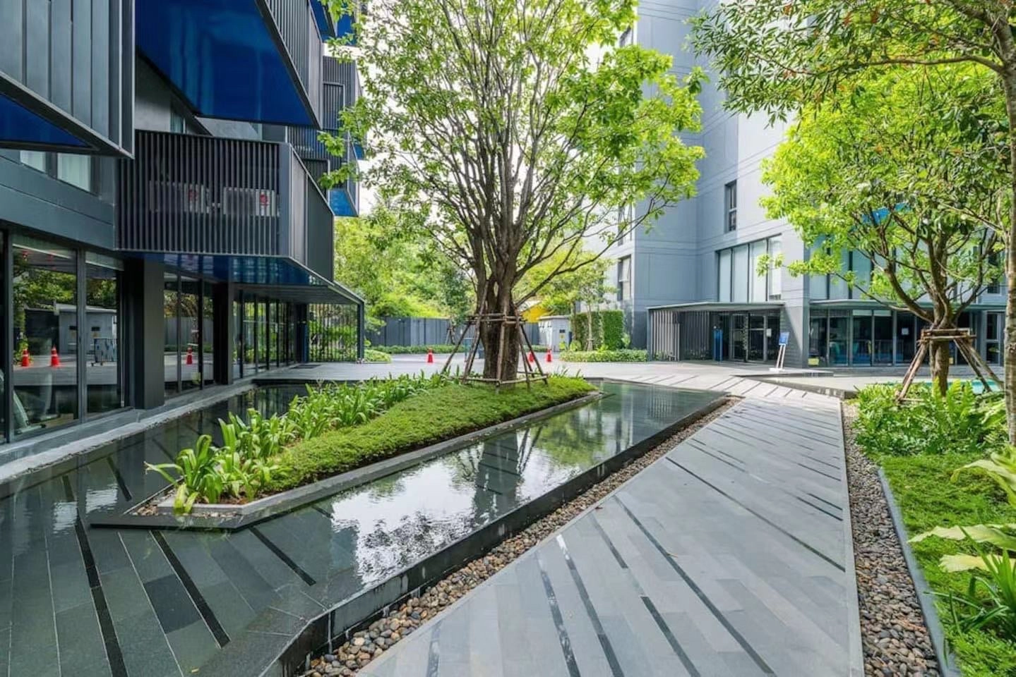 Completed condo courtyard at The Deck in Patong, an example of off-plan property in Thailand