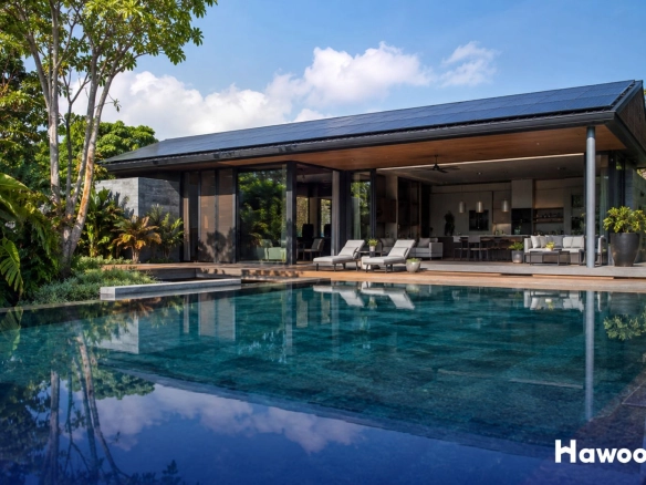 Modern smart grid eco villa in Phuket with rooftop solar panels, tropical landscaping, and luxury pool design